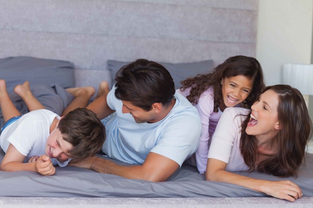 family smiling and laughing